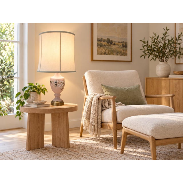 A charming mid-century table lamp featuring a frosted glass body adorned with a hand-painted floral motif in white, gold,...