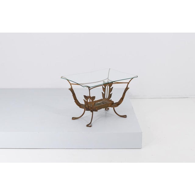 Delicious rectangular coffee table in curved brass, shaped glass top and decorative elements in the shape of large leaves...