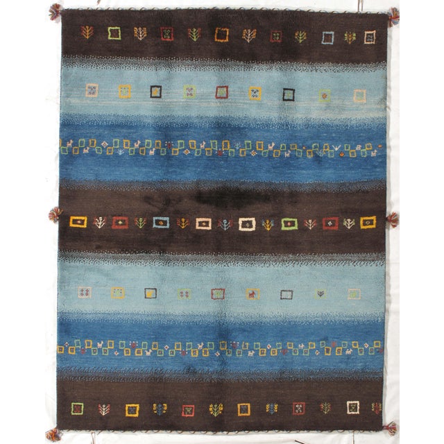 Vintage Hand-knotted Persian Lori Gabbeh rug featuring alternating horizontal bands in deep brown and tonal blue, accented...