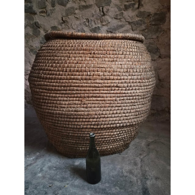 Impressive large antique grain basket originating from the Auvergne region of France and dating from around 1900. The...