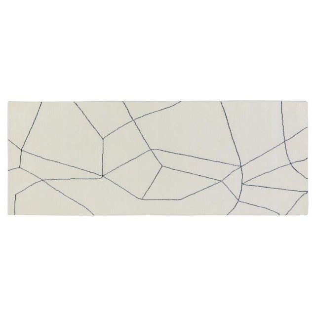 Hand-knotted with care using traditional rug-making techniques, this wool rug blends timeless craftsmanship with a modern...