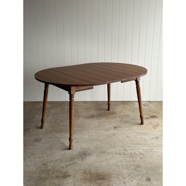 Vintage oval/round extension dining table by Tell City Chair Company with two optional leaves, solid maple wood frame and...