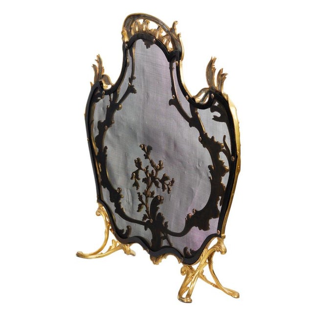 An impressive gilt bronze fireplace screen, representing a refined example of French decorative arts of the 19th century,...