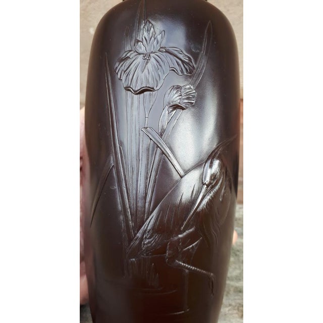 Bronze vase with brown patina decorated with an egret standing on one leg in front of a water iris. Exceptionally fine...