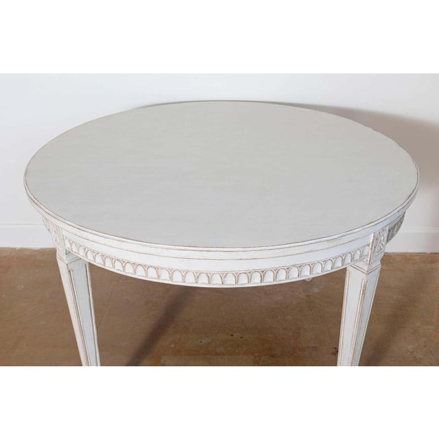 This elegant 19th-century Swedish center table is a beautiful example of Gustavian design, showcasing refined...