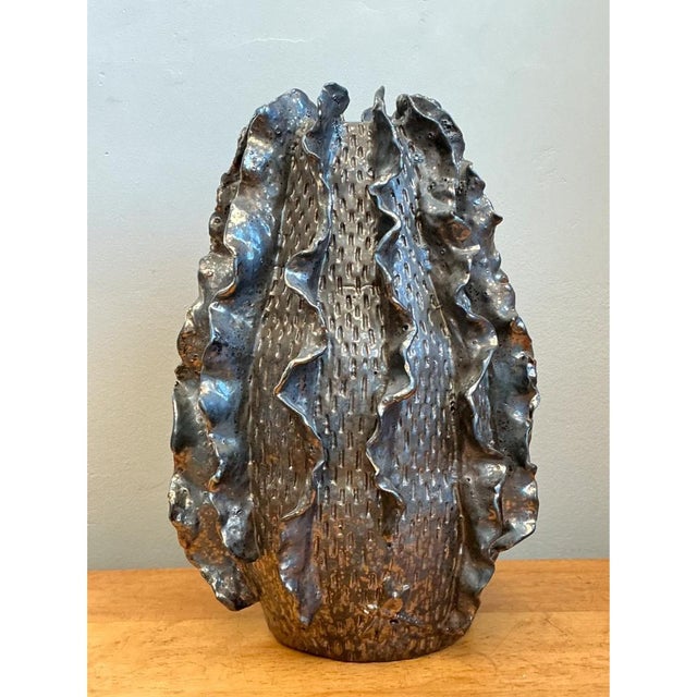 This striking vintage studio pottery vase is a masterclass in Organic Modern design, seamlessly blending earthy ceramic...