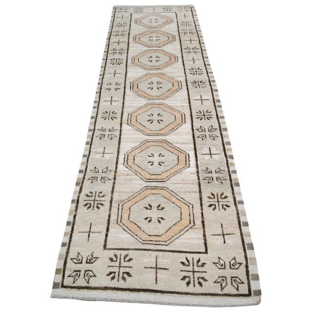 Turkish Oushak Hand-knotted with care using traditional rug-making techniques, this wool rug blends timeless craftsmanship...