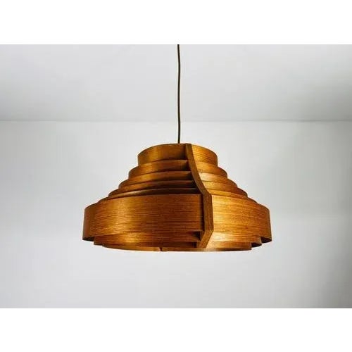 This wooden pendant lamp by hans-agne jakobsson, crafted in the 1960s, creates a very natural and inviting atmosphere,...