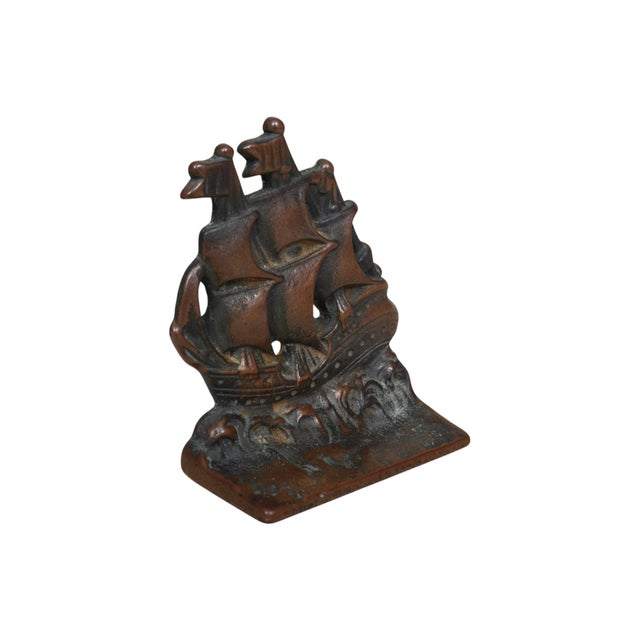 A pair of cast iron bookends made by Verona Steel Casting Company, circa 1920. Galleon ships are cast with three masts at...