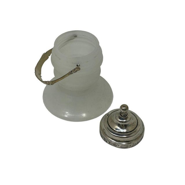 A 19th-century Opaline glass and silver matchbox or jar A matchbox is a historical ignition device consisting of a wooden...