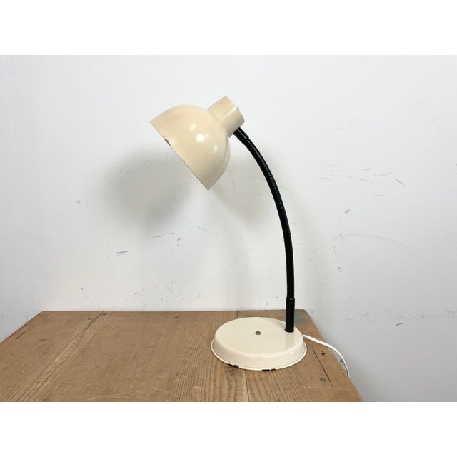 Industrial Workshop table lamp made in Poland during the 1960s.It features beige metal base and shade and black ruberized...