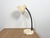 Industrial Workshop table lamp made in Poland during the 1960s.It features beige metal base and shade and black ruberized...
