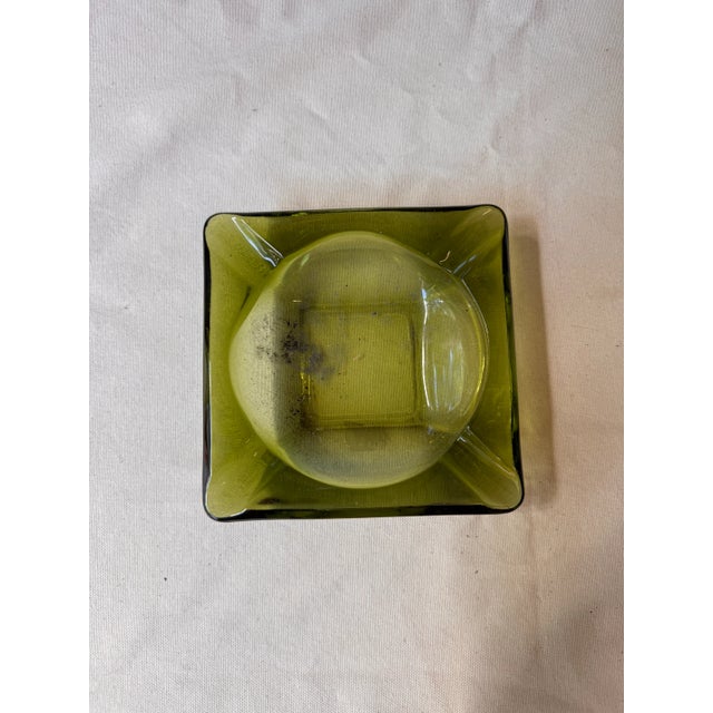 Up for consideration is a beautiful pair of green glass ashtrays. These would look lovely on display in your home and they...