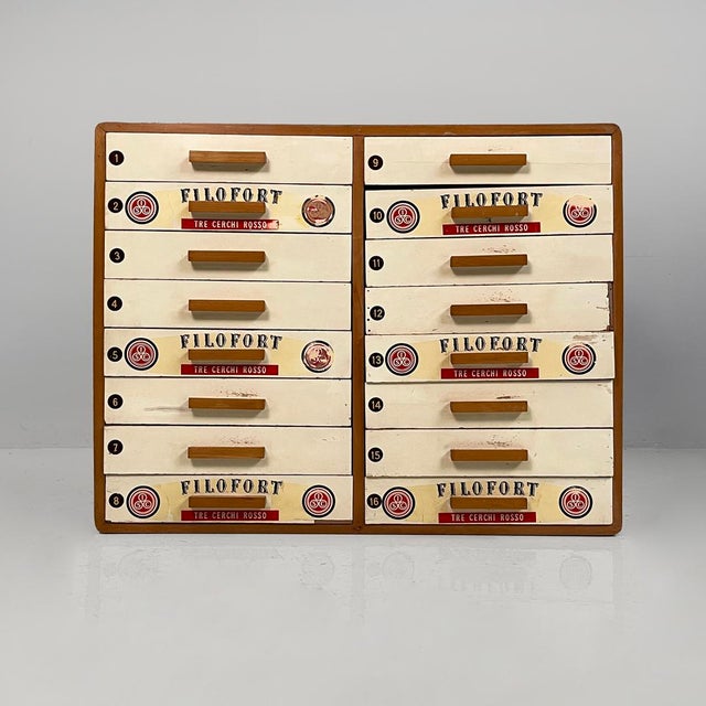 Italian mid-century modern sewing chest in wood by Filofort, 1960s Sewing chest with a wooden frame, featuring sixteen...