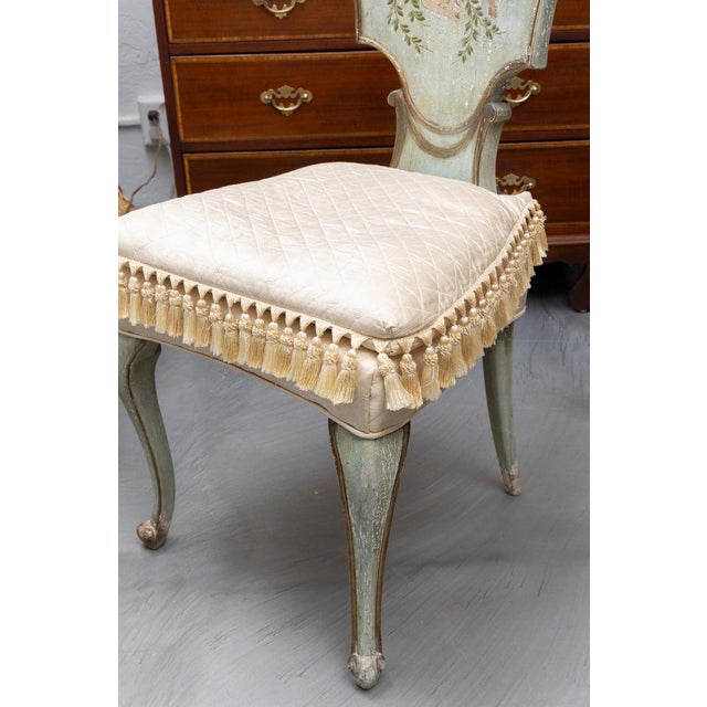 An elegant decorative side chair crafted in the Italian taste, featuring a shaped shield-form back with gracefully...
