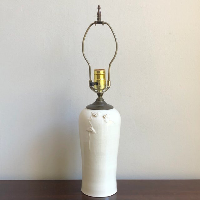 A beautiful studio pottery lamp from the mid-20th century. This is an exquisitely handcrafted pottery lamp with a graceful...