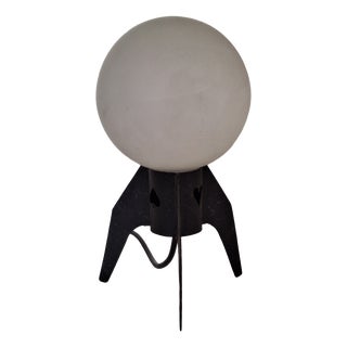 Mid-Century Table Lamp with a Black Iron Tripod Base and a White Opal Glass Shade, 1960s For Sale