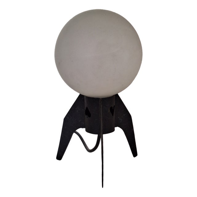 Mid-Century Table Lamp with a Black Iron Tripod Base and a White Opal Glass Shade, 1960s For Sale