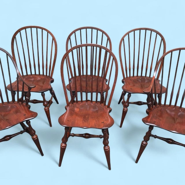 Set of 6 solid maple ER Buck Dining Chairs. Two with arms, 4 regular. Measure 18" wide, 20" deep, 37" tall, 18" seat height.