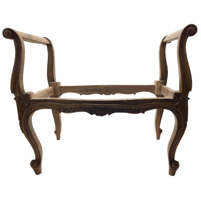 Beautifully carved Louis XV walnut bench. Features four elegant cabriole legs extending into the scrolled and contoured...