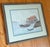 Charming 1990s folk art coastal seascape watercolor with nautical motifs of sailboats, a boathouse, and a distant...