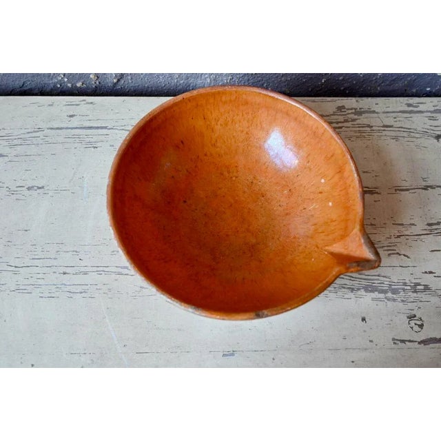 This large glazed earthenware bowl was once used for food preparation. Called a jatte or gresale, it is partially glazed...