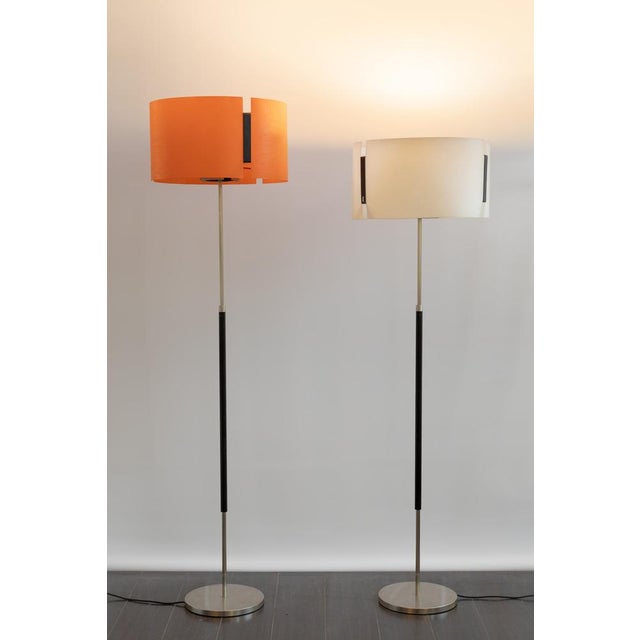 Rare pair of floor lamps designed in the mid -1950s by Ostuni and strong for their Oluce company, very modern for the era,...