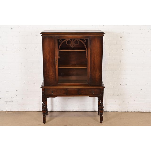 An exceptional English Jacobean style bookcase, china hutch, or bar cabinet By Charles P. Limbert Co USA, Circa 1920s...