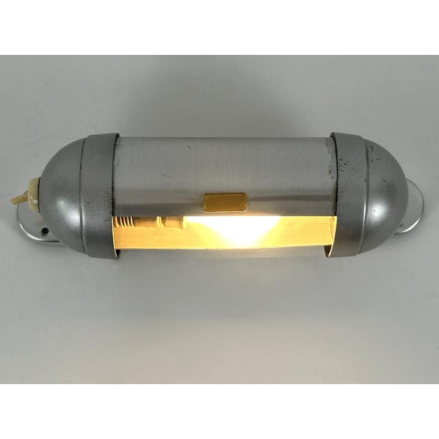 Elegant and minimalistic streamlined design sub-marine cabinet / u-boot sconce or wall fixture by könig, germany, 1940s....