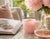 A beautifully hand-carved cup crafted from 100% natural rose quartz, prized for its soft blush-pink color, gentle...