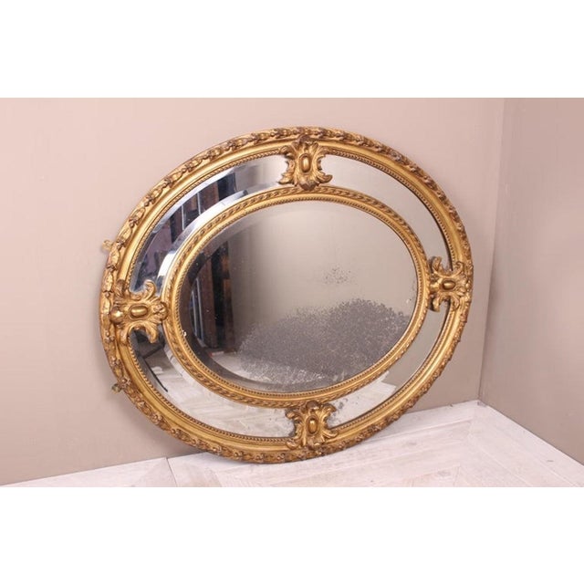 A beautiful Victorian giltwood oval marginal plate mirror of good proportions. The oval wood and gesso frame equally...