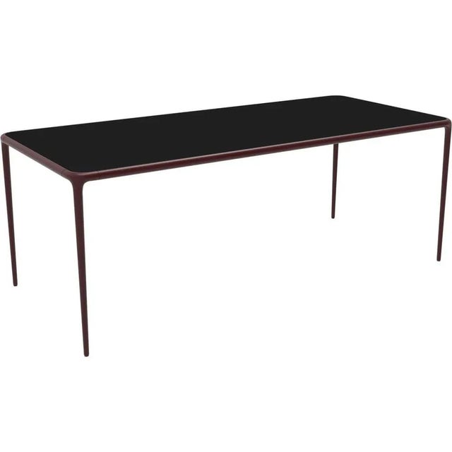 Xaloc burgundy glass top 200 table by mowee dimensions: d200 x w90 x h74 cm material: aluminium, tinted tempered glass...