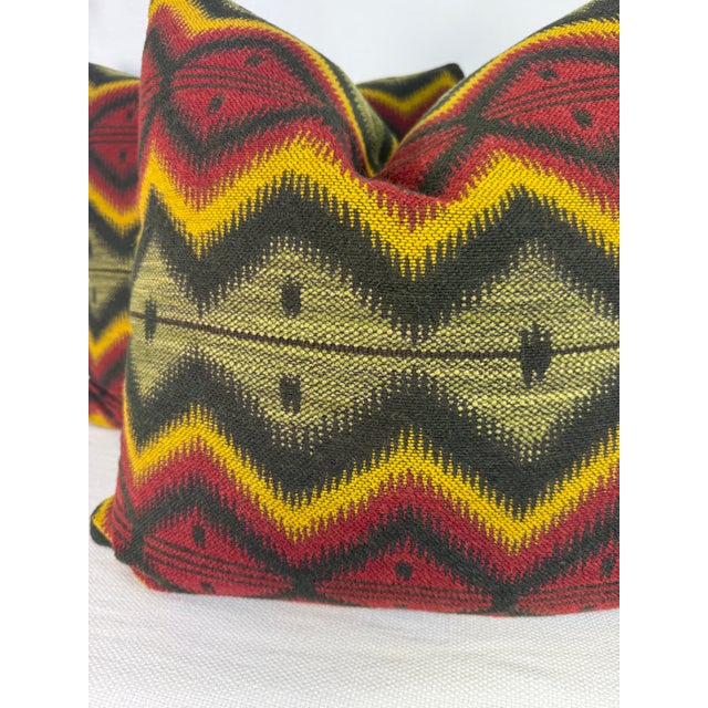 Custom pair of 22" pillows covered in Mind the Gap "Pyramidenspitzer" wool blend fabric in color green/red/yellow. These...