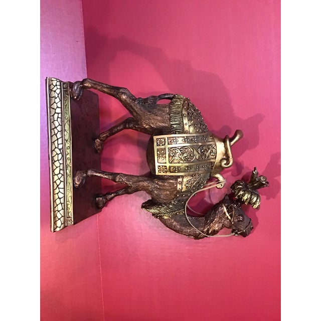 Add a touch of global elegance to your décor with this beautifully detailed camel figurine from the 2007. This piece...