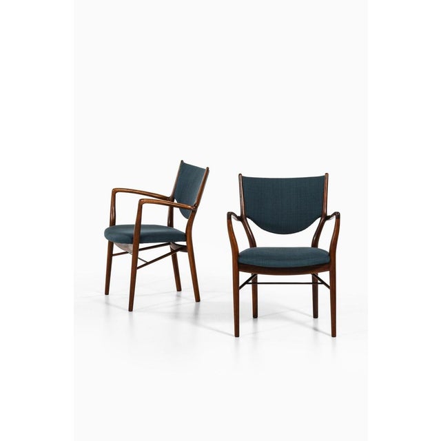 Pair of armchairs in rosewood and original fabric by finn juhl, 1946 additional information: material: rosewood and...