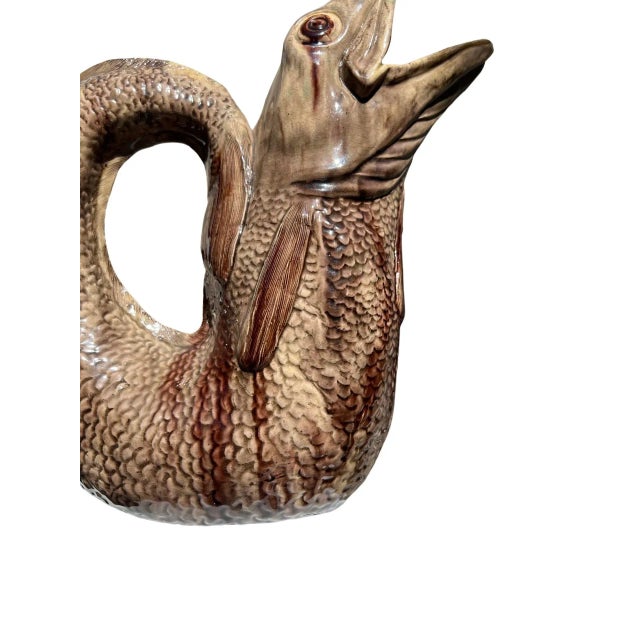 European, 19th century. An incredibly unusual and interesting majolica pitcher. The water pitcher features a finely...