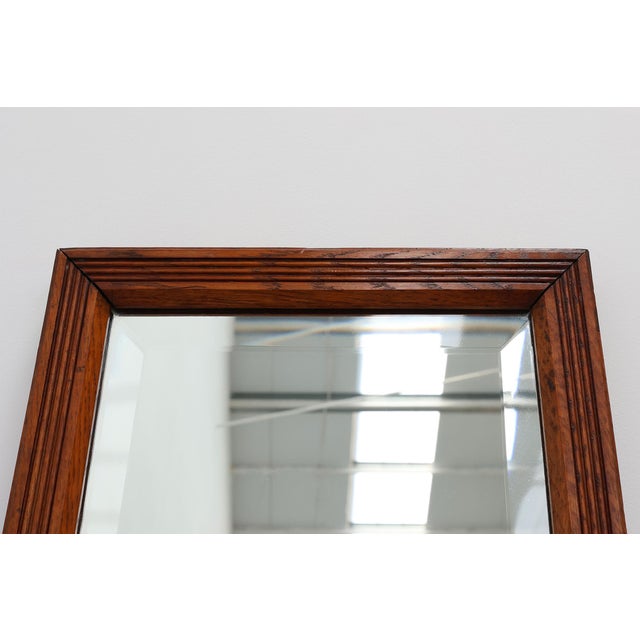 France / 1930 / mirror / oak / Art Deco Rectangular Art Deco mirror with geometric carved frame in solid oak. Made in...