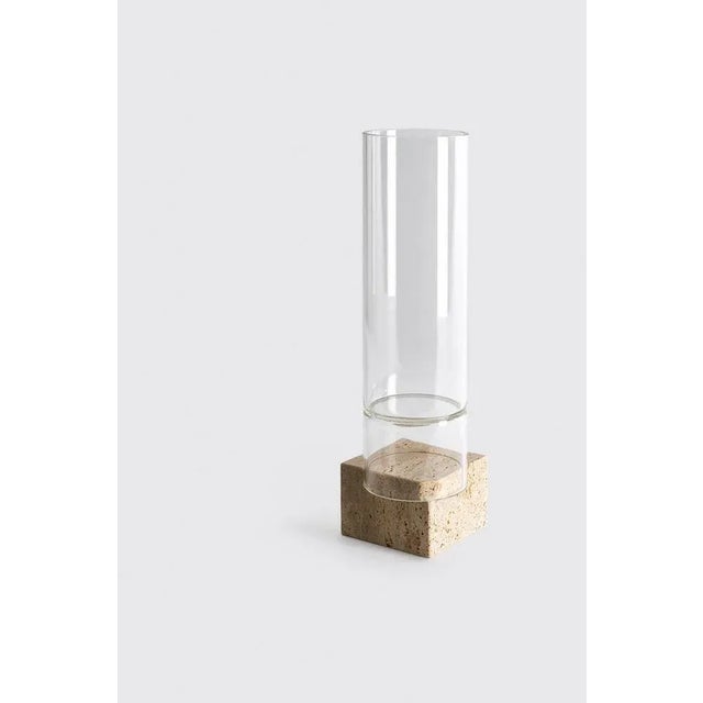 Segno vase i - giorgio bonaguro dimensions: d 12 x w 12 x h 44 cm materials: travertine, glass. A collection that was born...