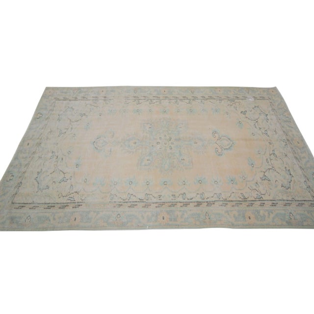 Washed out vintage faded rug from Oushak region of Turkey. Approximately 50-60 years old. In very good condition