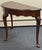 Beautiful Georgian style Demi lune table by Kincaid. Features prominent carved shell motifs on the knee of each leg,...