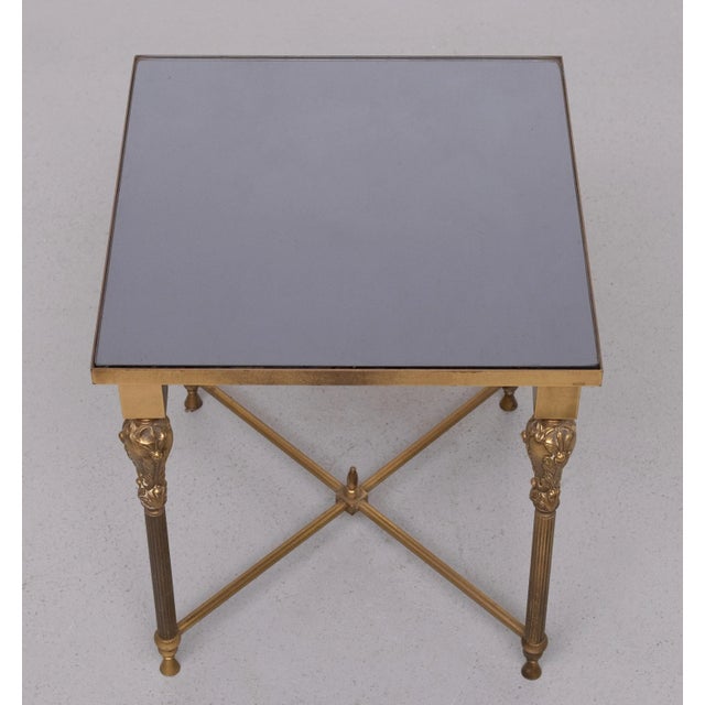 Top quality side table . Mirror top .Ornate Brass base . square shaped .