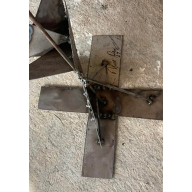 A stunning Contemporary Original sculpture. A chic Abstract composition forged from welded steel. A kinetic structure adds...