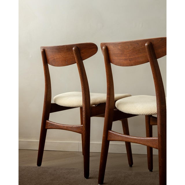 A vintage set of 4 ch30 dining chairs in teak, oak and cream textured upholstery, designed by hans j. Wegner for carl...