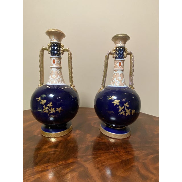 Pair Of Royal Worcester Hand Painted Porcelain Cobalt Blue Vases with Two Handles. Lovely floral pattern. Very good...