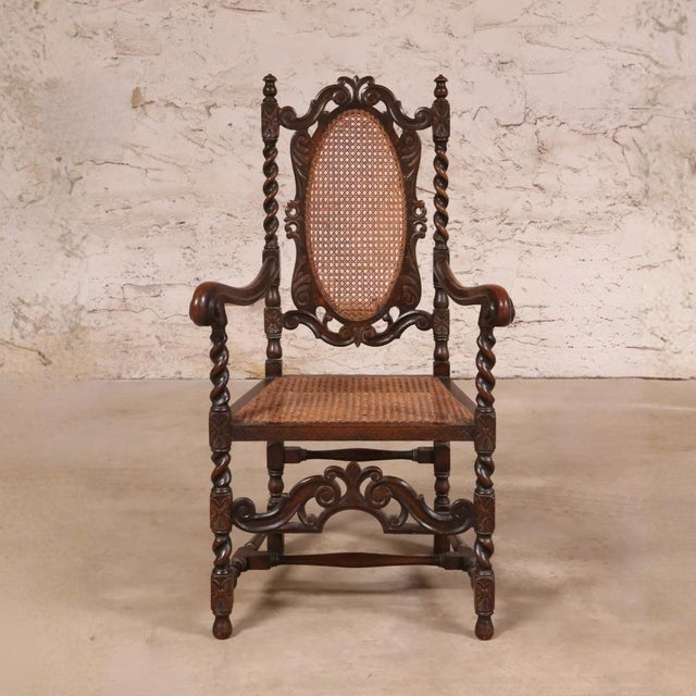 This 19th Century English Oak Barley Twist and Cane Chair is a distinctive antique that highlights the craftsmanship and...