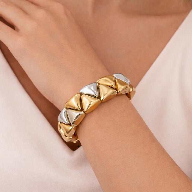 18k Gold Hersheys Kisses Bracelet 92.05 grams. 7.5 in length. 0.75 in width. Yellow, white and rose gold accents.