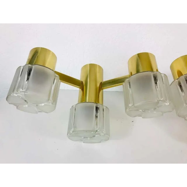 Midcentury pair of beautiful wall lights in the style of Hans Agne Jakobsson made in the 1960s. They have three glass...