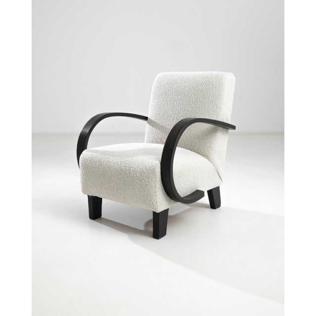 Introducing the 1950s Czech Wooden Armchair by J. Halabala, a timeless piece that combines vintage charm with modern...