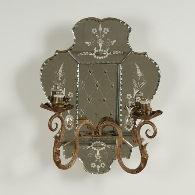 Glamorous pair of antique Italian wall sconces featuring mirrored glass panels with reverse etched floral and geometric...