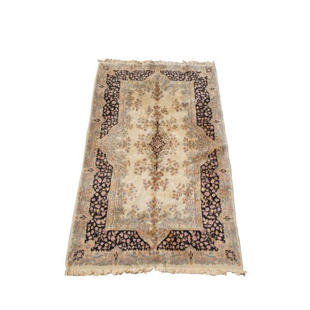 A classic French Aubusson rug, circa last half 20th century. Features a beige foregournd with light blue and navy border....